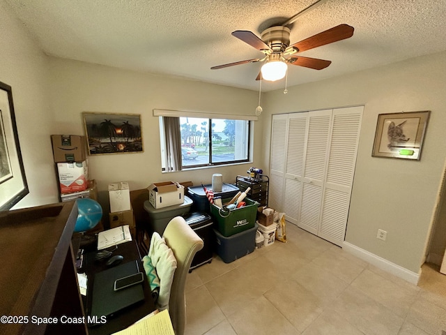 2915 Kirkland Rd NE, Palm Bay, FL 32905 - office area featuring ceiling fan, a textured ceiling, baseboards, and light tile patterned floors
