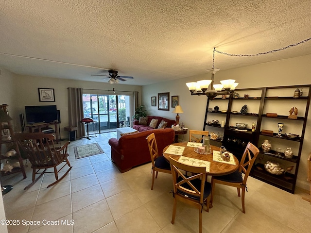 2915 Kirkland Rd NE, Palm Bay, FL 32905 - dining area with a chandelier, a textured ceiling, a ceiling fan, and light tile patterned floors