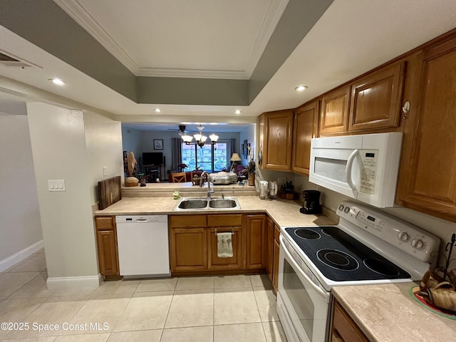 2915 Kirkland Rd NE, Palm Bay, FL 32905 - kitchen featuring white appliances, a sink, brown cabinets, light countertops, and crown molding