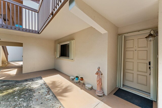 2915 Kirkland Rd NE, Palm Bay, FL 32905 - property entrance featuring stucco siding