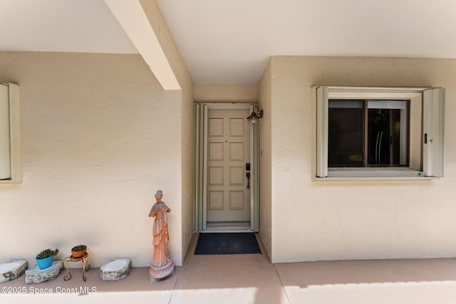 2915 Kirkland Rd NE, Palm Bay, FL 32905 - doorway to property featuring stucco siding