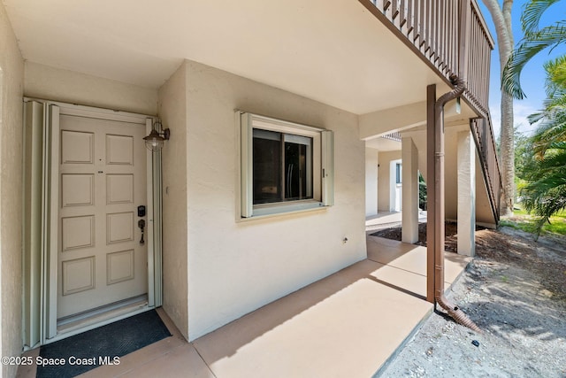 2915 Kirkland Rd NE, Palm Bay, FL 32905 - property entrance with stucco siding