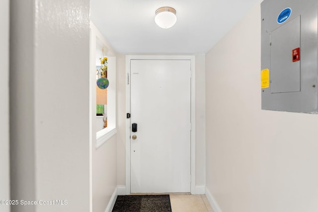 2915 Kirkland Rd NE, Palm Bay, FL 32905 - doorway to outside featuring electric panel and tile patterned flooring