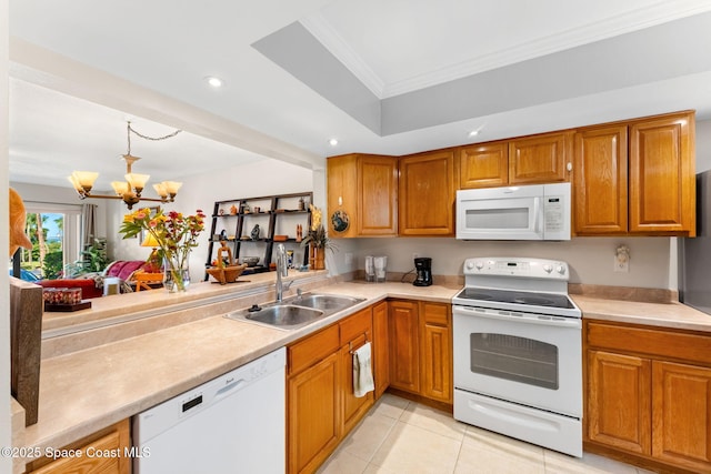 2915 Kirkland Rd NE, Palm Bay, FL 32905 - kitchen featuring white appliances, brown cabinetry, light countertops, ornamental molding, and recessed lighting