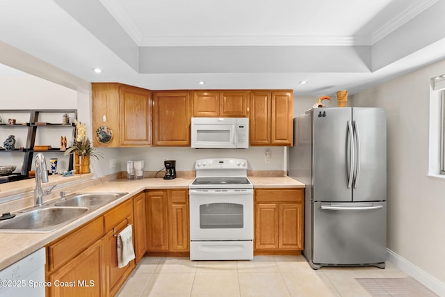 2915 Kirkland Rd NE, Palm Bay, FL 32905 - kitchen with white appliances, ornamental molding, light countertops, a tray ceiling, and light tile patterned flooring
