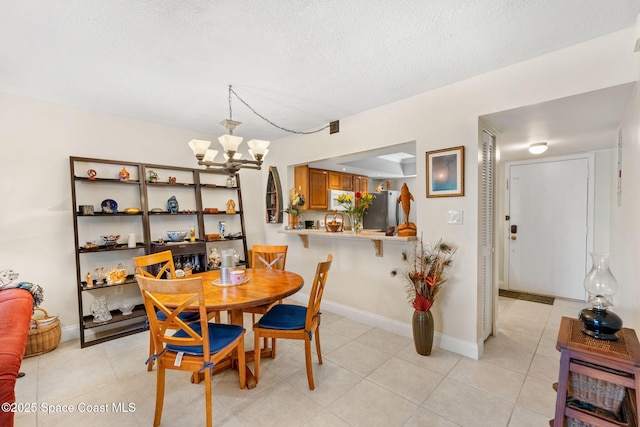 2915 Kirkland Rd NE, Palm Bay, FL 32905 - dining area with a chandelier, light tile patterned floors, and a textured ceiling