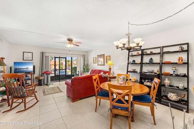 2915 Kirkland Rd NE, Palm Bay, FL 32905 - dining room with a chandelier, ceiling fan, light tile patterned flooring, and a textured ceiling