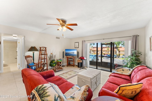 2915 Kirkland Rd NE, Palm Bay, FL 32905 - tiled living area with a ceiling fan and baseboards