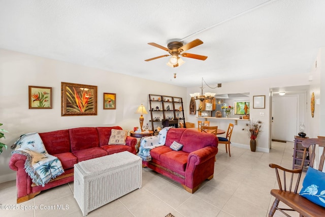 2915 Kirkland Rd NE, Palm Bay, FL 32905 - living room featuring ceiling fan, light tile patterned floors, and a chandelier