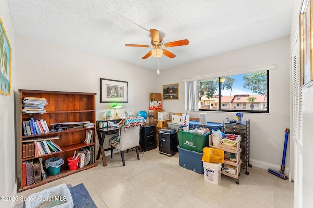 2915 Kirkland Rd NE, Palm Bay, FL 32905 - tiled home office featuring a ceiling fan and a textured ceiling