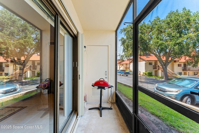 2915 Kirkland Rd NE, Palm Bay, FL 32905 - sunroom / solarium featuring a residential view and healthy amount of natural light