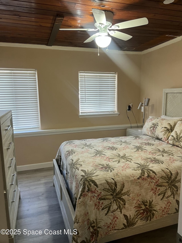6409 Ridgewood Ave Unit 6409, Cocoa Beach, FL 32931 - bedroom featuring wooden ceiling, ornamental molding, wood finished floors, baseboards, and a ceiling fan