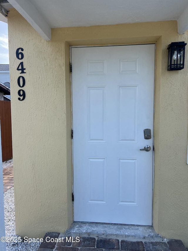 6409 Ridgewood Ave Unit 6409, Cocoa Beach, FL 32931 - property entrance featuring stucco siding