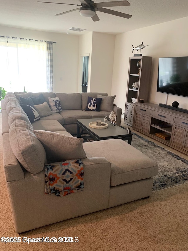 4529 Vermillion Dunes Ln, Melbourne, FL 32904 - living room with a ceiling fan and carpet