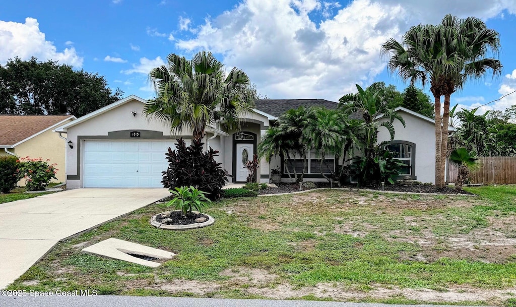 6313 Leonard Ave, Cocoa, FL 32927 - ranch-style home featuring stucco siding, an attached garage, and driveway