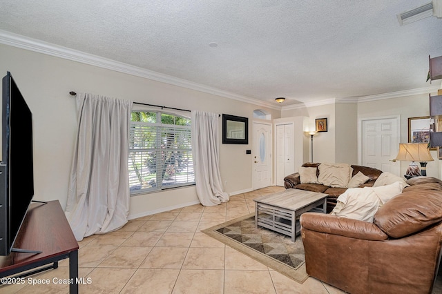 6313 Leonard Ave, Cocoa, FL 32927 - living area with a textured ceiling, crown molding, and light tile patterned flooring