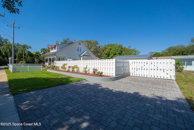 1248 Highland Ave, Melbourne, FL 32935 - view of home's exterior with a gate