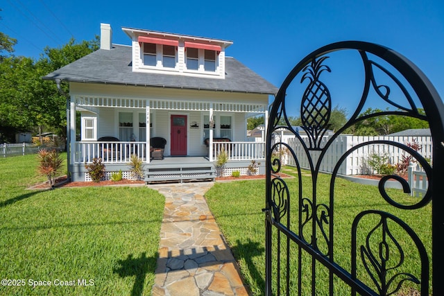 1248 Highland Ave, Melbourne, FL 32935 - view of front of home featuring a porch, a chimney, and a shingled roof