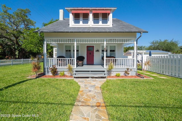 1248 Highland Ave, Melbourne, FL 32935 - view of front of property featuring covered porch, roof with shingles, and a chimney