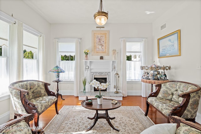 1248 Highland Ave, Melbourne, FL 32935 - living area featuring wood finished floors, a fireplace, and baseboards