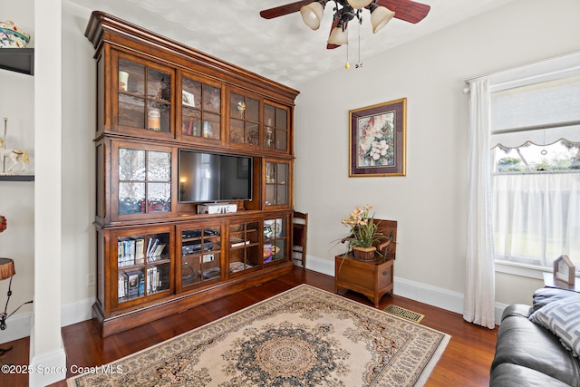 1248 Highland Ave, Melbourne, FL 32935 - living area featuring ceiling fan, wood finished floors, and baseboards