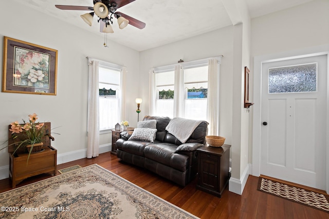1248 Highland Ave, Melbourne, FL 32935 - living area featuring dark wood finished floors, a ceiling fan, and baseboards