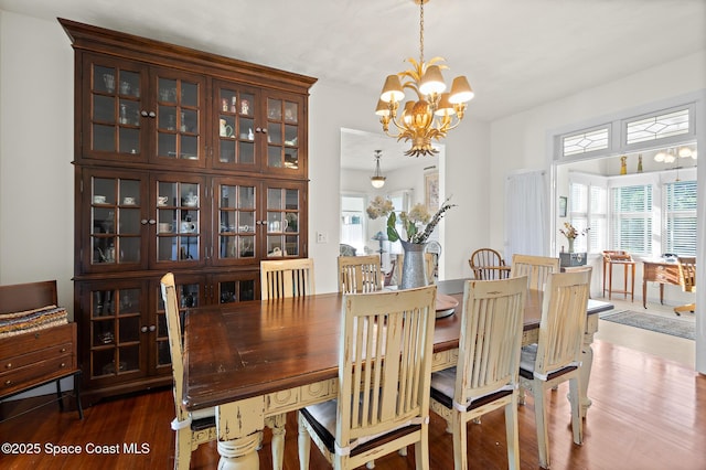 1248 Highland Ave, Melbourne, FL 32935 - dining area featuring a chandelier and wood finished floors