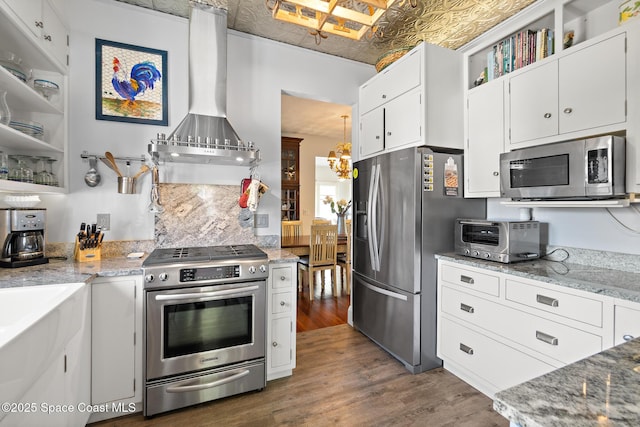 1248 Highland Ave, Melbourne, FL 32935 - kitchen featuring stainless steel appliances, an ornate ceiling, dark wood-style floors, wall chimney range hood, and white cabinets