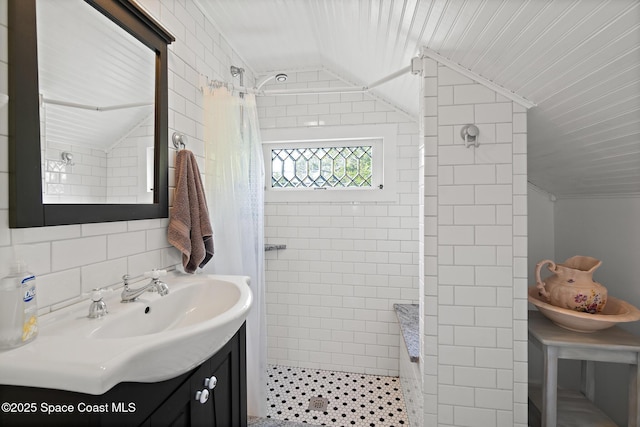 1248 Highland Ave, Melbourne, FL 32935 - full bathroom with lofted ceiling, tiled shower, and vanity