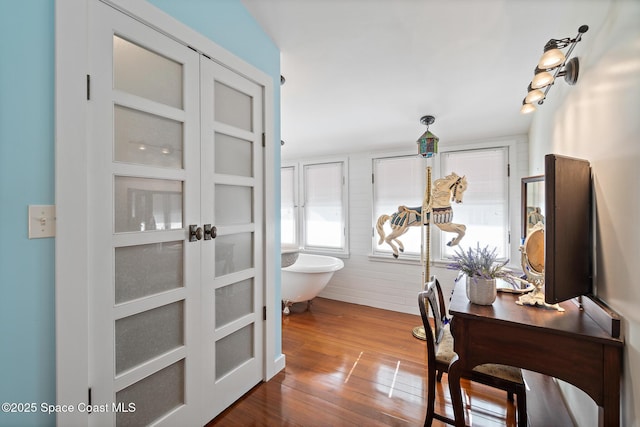 1248 Highland Ave, Melbourne, FL 32935 - hallway featuring french doors and dark wood finished floors