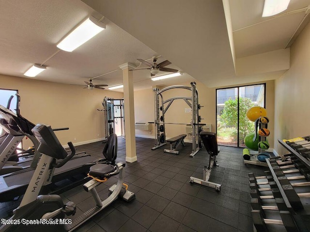 2100 N Atlantic Ave Unit 1207, Cocoa Beach, FL 32931 - gym featuring a ceiling fan and baseboards
