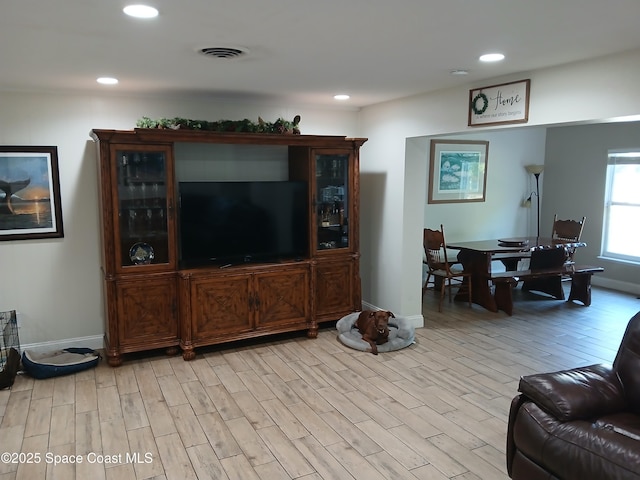 900 E Richland Ave, Merritt Island, FL 32953 - living room with light wood-type flooring, recessed lighting, and baseboards