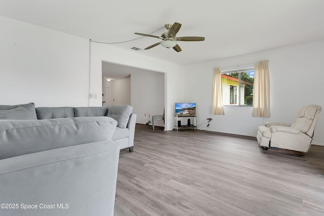 741 Alaska Ave NE, Palm Bay, FL 32907 - living area featuring ceiling fan and light wood-style floors