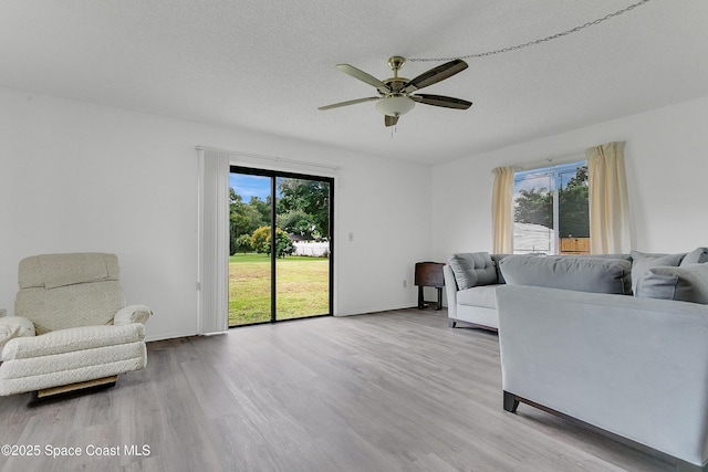 741 Alaska Ave NE, Palm Bay, FL 32907 - living area featuring ceiling fan and wood finished floors