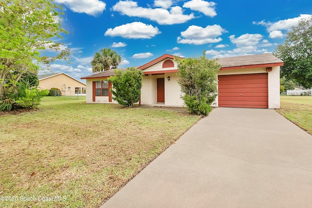 741 Alaska Ave NE, Palm Bay, FL 32907 - ranch-style house featuring driveway, stucco siding, a front yard, and a garage
