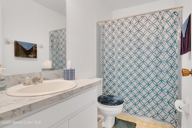 741 Alaska Ave NE, Palm Bay, FL 32907 - bathroom featuring toilet, vanity, and a shower with curtain