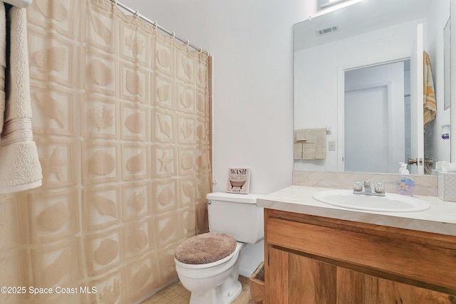 741 Alaska Ave NE, Palm Bay, FL 32907 - bathroom featuring toilet, vanity, and curtained shower