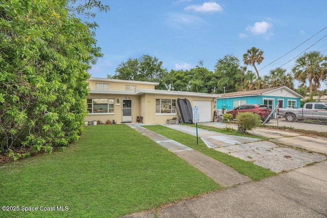 246 Orange St, Cocoa, FL 32922 - view of front of house featuring concrete driveway, an attached garage, and stucco siding