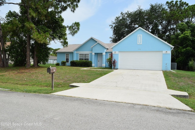 1711 Radisson St NW, Palm Bay, FL 32907 - ranch-style home with driveway, a garage, a front yard, and stucco siding