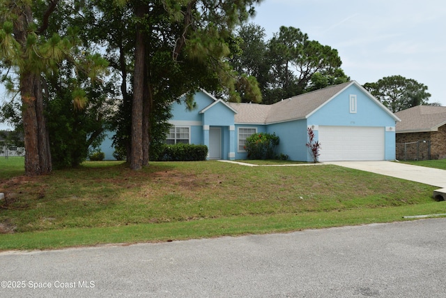 1711 Radisson St NW, Palm Bay, FL 32907 - ranch-style home with a garage, driveway, stucco siding, and a front yard