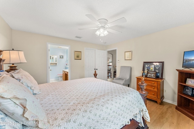 775 Triple Crown Ln, Melbourne, FL 32904 - bedroom featuring light wood-type flooring, ceiling fan, ensuite bathroom, and baseboards