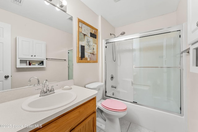775 Triple Crown Ln, Melbourne, FL 32904 - full bathroom with toilet, vanity, tile patterned flooring, and combined bath / shower with glass door
