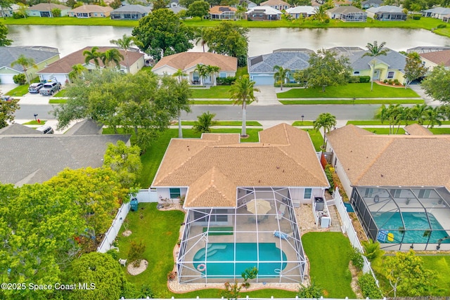 775 Triple Crown Ln, Melbourne, FL 32904 - aerial perspective of suburban area with a pool area and a nearby body of water