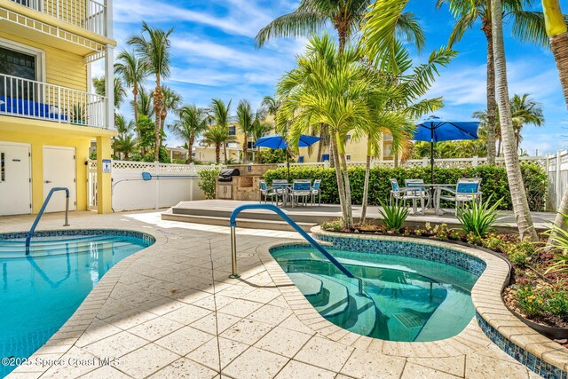 505 S Miramar Ave Unit 2403, Indialantic, FL 32903 - view of swimming pool featuring a swimming pool, a patio area, and outdoor dining space