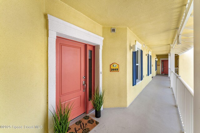 505 S Miramar Ave Unit 2403, Indialantic, FL 32903 - view of exterior entry with stucco siding