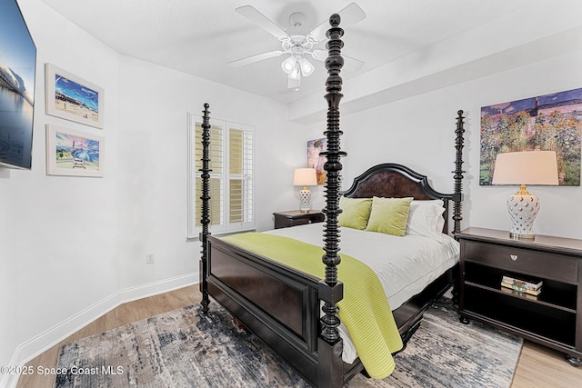 505 S Miramar Ave Unit 2403, Indialantic, FL 32903 - bedroom featuring wood finished floors, baseboards, and ceiling fan