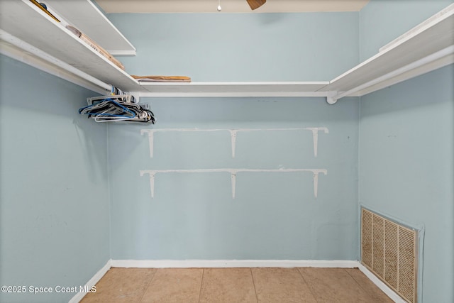 3820 Ocean Beach Blvd Unit 1, Cocoa Beach, FL 32931 - spacious closet featuring a ceiling fan