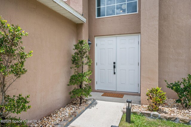 5256 Mansford Pl, Melbourne, FL 32940 - property entrance with stucco siding