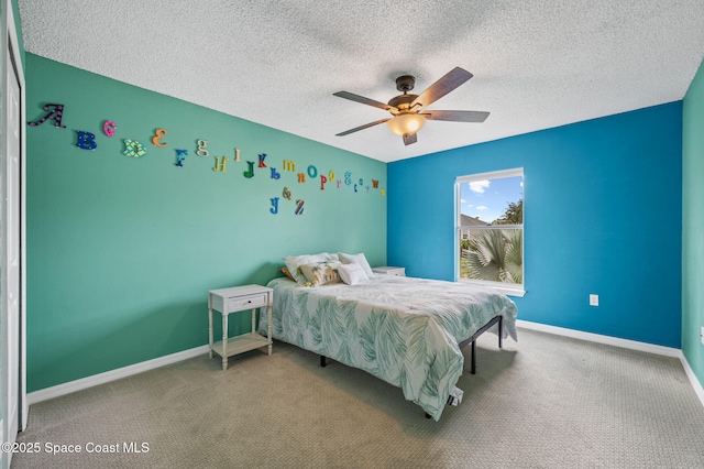 5256 Mansford Pl, Melbourne, FL 32940 - carpeted bedroom with baseboards, a textured ceiling, and a ceiling fan