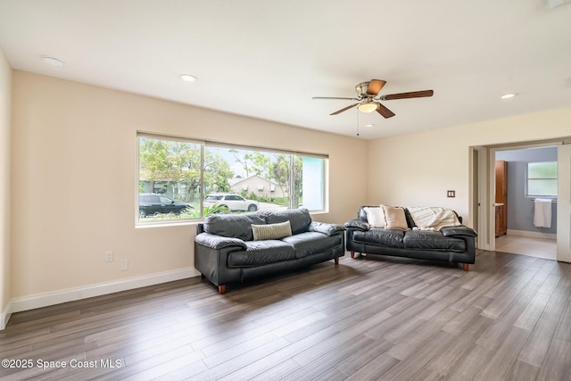 485 Poinciana Dr, Melbourne, FL 32935 - living area featuring plenty of natural light, wood finished floors, ceiling fan, and recessed lighting